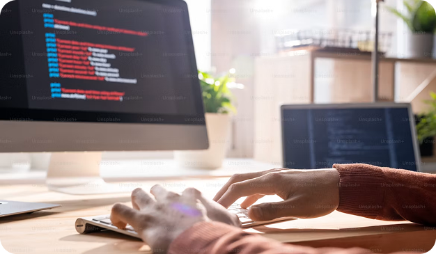 Developer working at a computer — legacy software modernization