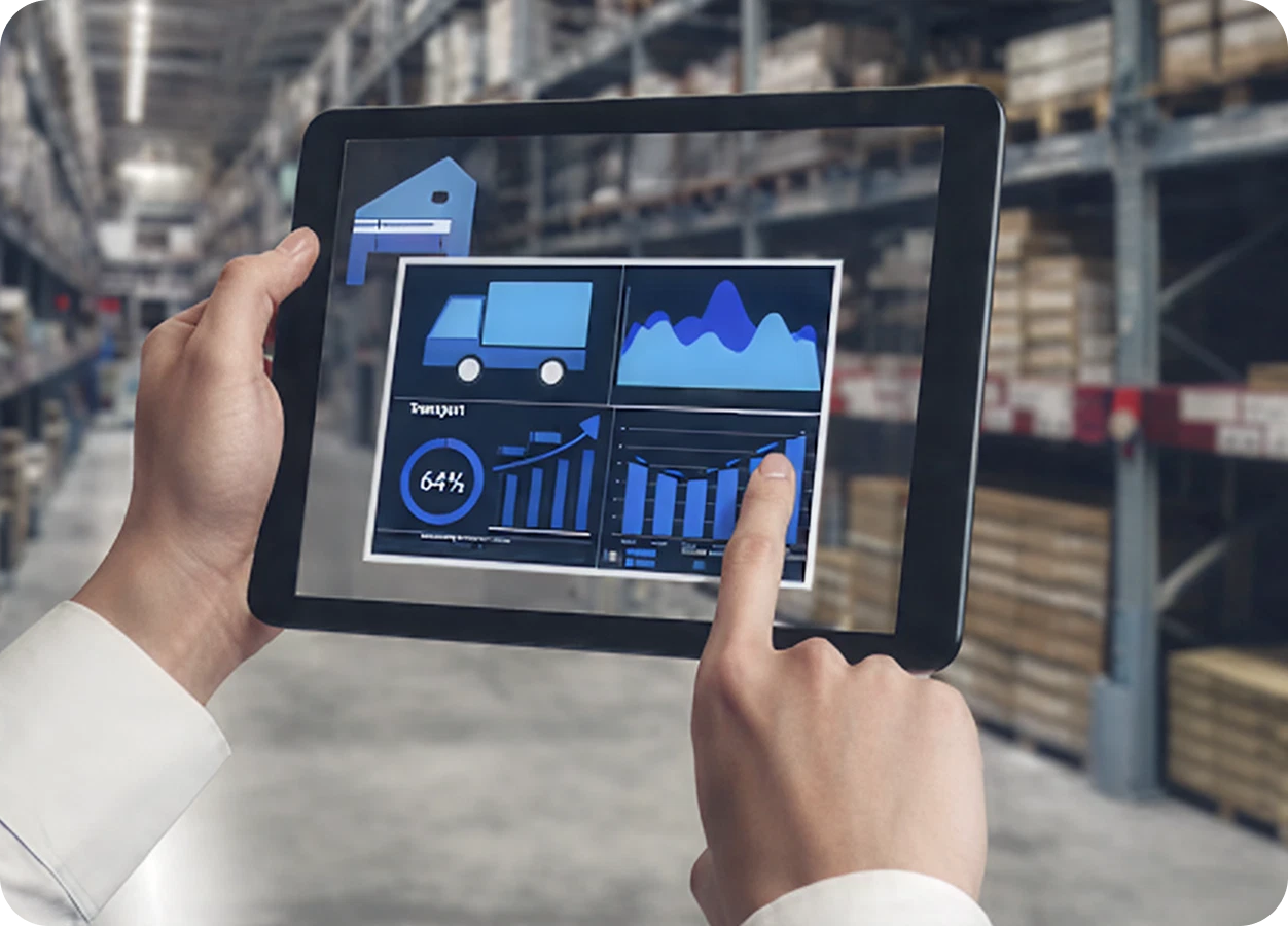 Person reviewing logistics data on a tablet in a warehouse